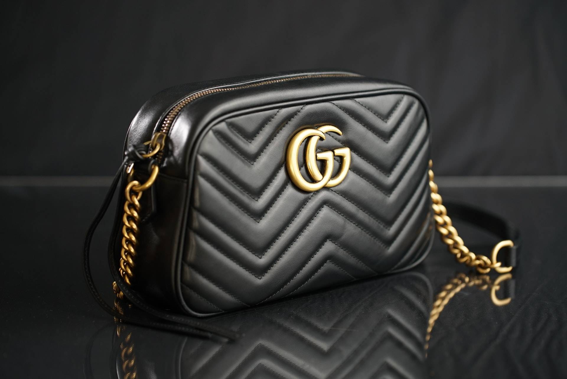 A black Gucci handbag - Dato Darren Yaw